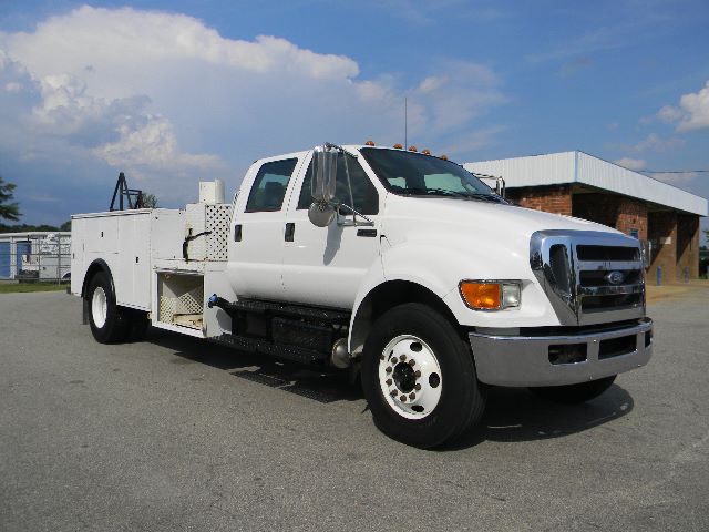 Ford F-750 Super Duty Service/Utility truck side view showing crew cab and utility body.