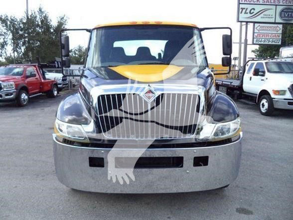 Front view of a 2019 International DURASTAR 4300 truck showing chrome grille, headlights, and bumper.