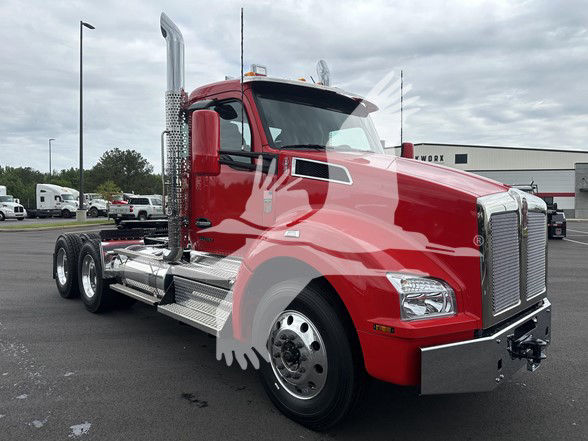 Red 2026 Kenworth T880 conventional daycab truck shown from front-left angle with chrome exhaust stacks and dual rear axles.