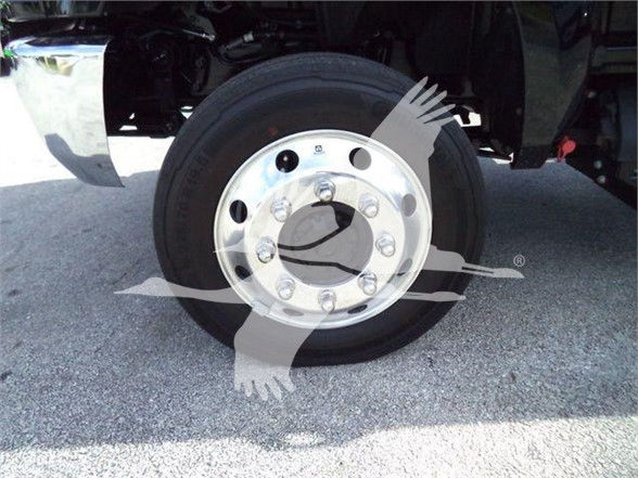Wheel and hub of a new 2023 International CV truck showing steel wheel with multiple lug nuts.