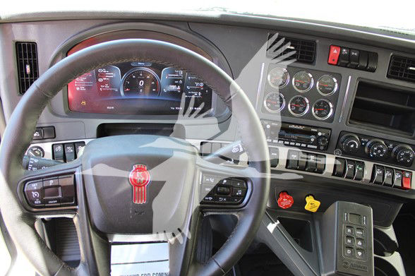 Kenworth T880 truck interior dashboard and steering wheel with gauge cluster and control panel visible.