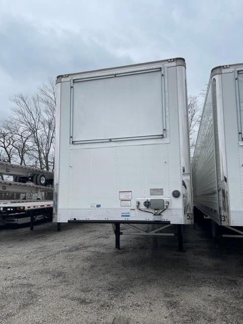 Reefer trailer back view showing rear doors and mounting hardware, CIMC Cool Globe branding not visible, white exterior, trailer on lot.