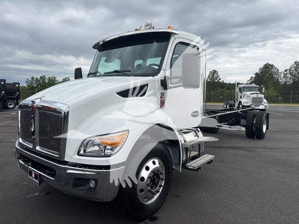 Kenworth T380 cab and chassis white truck with a flatbed trailer in a parking lot, front three-quarter view, VIN plate visible, stock TM194103.