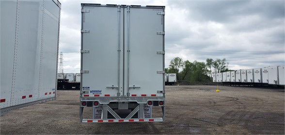 Back view of a Vanguard MAXCUBE dry van trailer showing rear doors, taillights, and reflective safety decals.