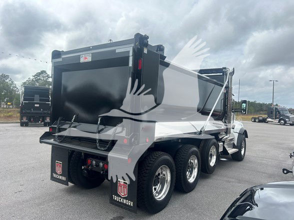 Kenworth T880 dump truck rear/side view showing dump body, dual rear axles, and mud flaps with TUKWORKS branding.