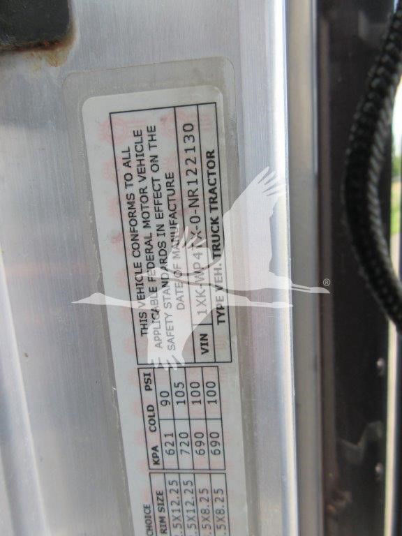 Truck door sticker with VIN, type, and axle specifications visible on a Kenworth W900B listing.