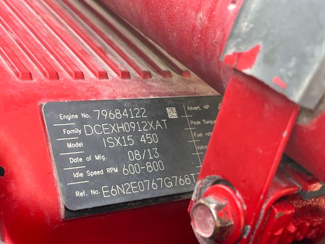 Engine plate on Kenworth T800 showing Engine No. 79684122, Family DCEYXH012XAT, Model ISX15 450, Date of Mfg 08/13, Idle Speed RPM 600-800, Ref. No. E6N2E0767G78