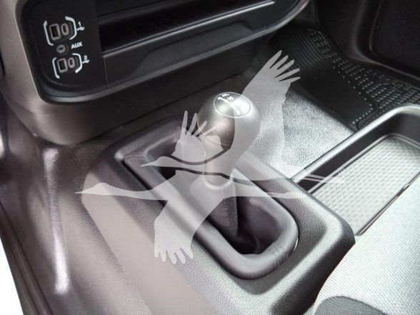 Ram 4500 interior showing manual gear shift lever and center console area.