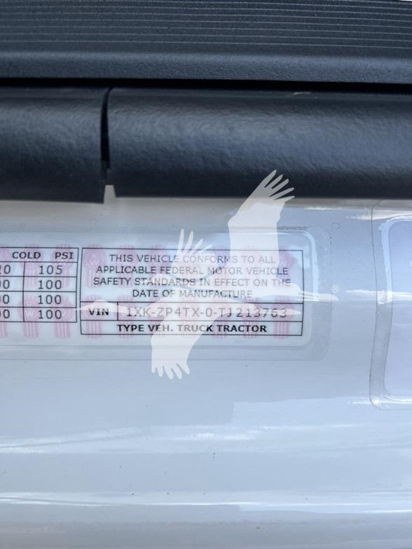 Vehicle label showing VIN and standard information. Text: THIS VEHICLE CONFORMS TO ALL APPLICABLE FEDERAL MOTOR VEHICLE SAFETY STANDARDS IN EFFECT ON THE DATE OF MANUFACTURE VIN ... TYPE VEH. TRUCK TRACTOR. Tables with COLD PSI readings par