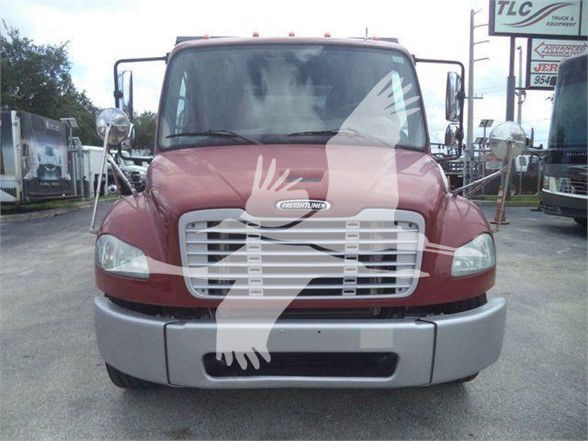 Front view of a maroon Freightliner Business Class M2 106 truck showing grille, bumper, and windshield with side mirrors.
