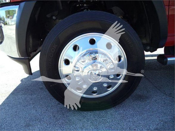 Ram 5500 front wheel with chrome hubcap and tire, partial fender and wheel well visible.