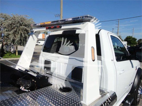 Ram 4500 SLT tow truck rear bed with metal diamond plate surface and recovery winch area.