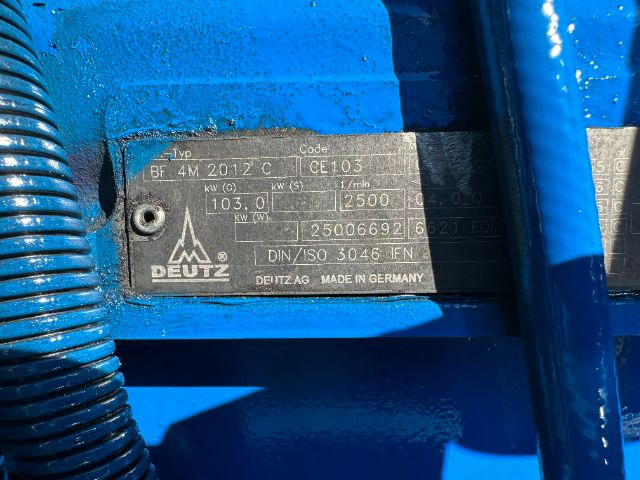 Plate on blue truck showing DEUTZ logo and technical data: Typ BF 4M 2012 C; Code CE103; 103.0 kW? 2500 rpm; 25006692 6? DIN ISO 3046 EN; MADE IN GERMANY.
