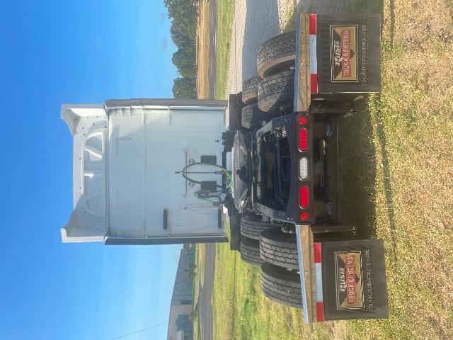 Truck chassis back view of a 2019 Peterbilt 579 conventional sleeper showing rear wheel wells, fifth wheel hitch, and dual rear axles.