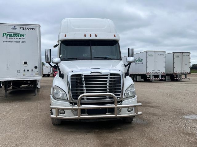 Front view of a 2017 Freightliner Cascadia sleeper cab truck with chrome grille guard and dual headlights.