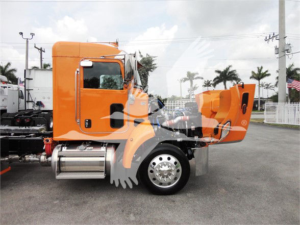2022 Peterbilt 337 front half with cab and orange exterior; side view shows wheel, fuel tank, and sleeper area; stock number J06176.