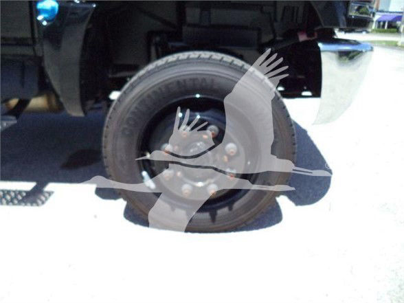 Truck wheel and front left tire with rim and part of body; watermark overlay across center.