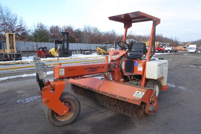 Laymor SM300 road roller with orange drum and operator seat, side view.