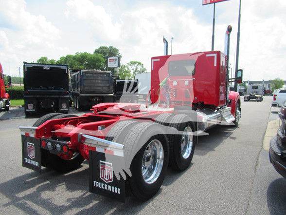 Kenworth W990 tractor rear and sleeper cab seen from left side in red with dual rear axles and mud flaps.