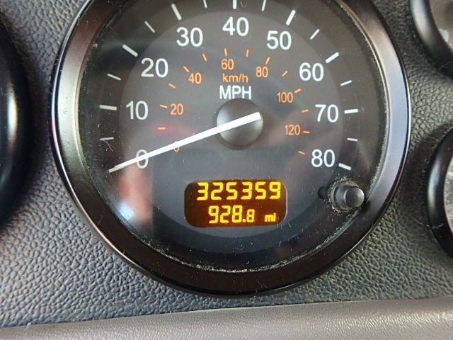 Dashboard speedometer shows MPH with odometer reading 325359 and 928.8 mi trip.