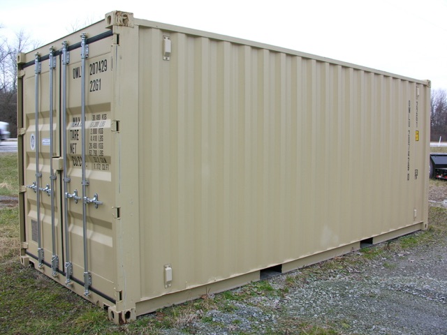 Container trailer showing rear doors with metal locking bars and high-cube shipping container design on a gravel lot.