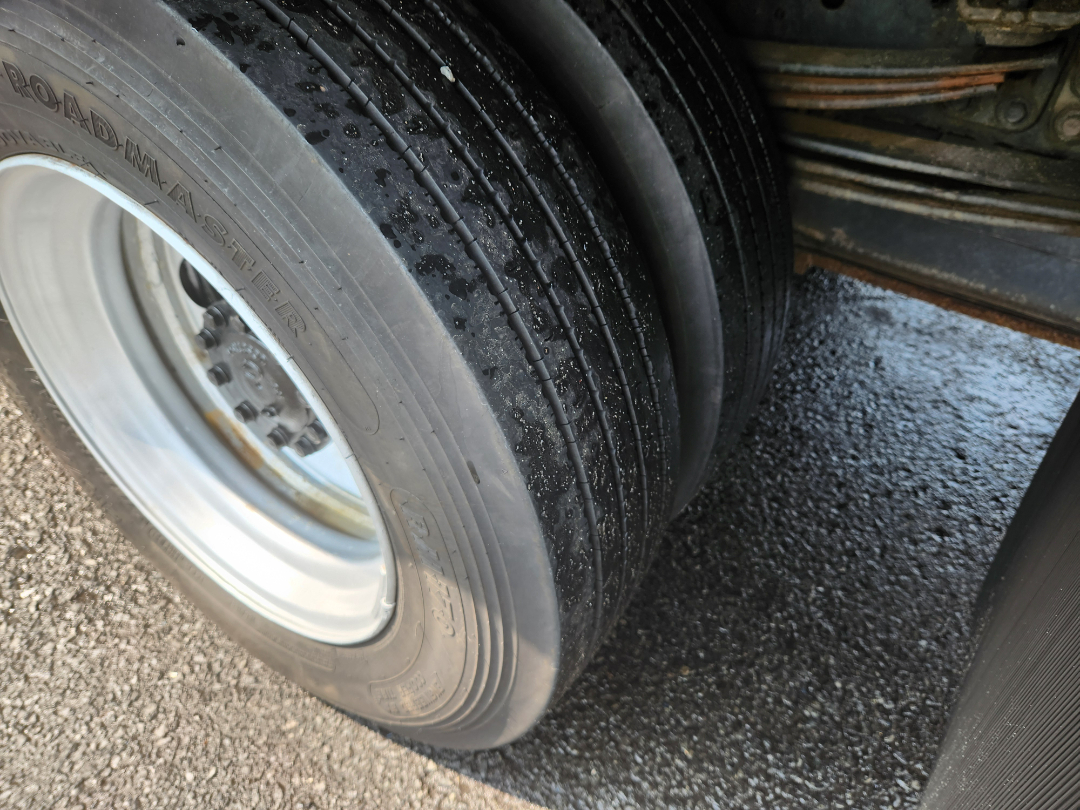 Rear dual-axle truck tire and wheel on a 2017 Hino 155, showing tire tread, sidewall markings, and rim.