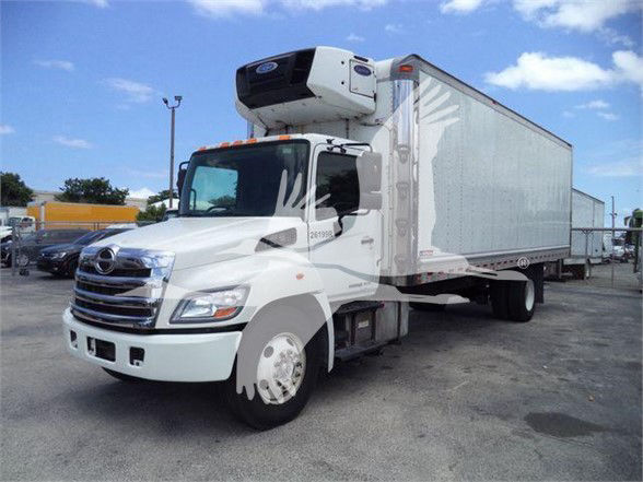 Truck with a refrigerated box and front-mounted APU unit, white cab, 2019 model year, Reefer truck.