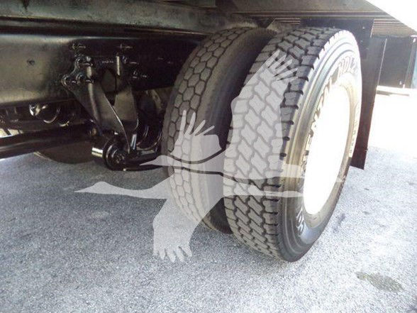 International truck rear dual tires and suspension components visible under the cargo box.
