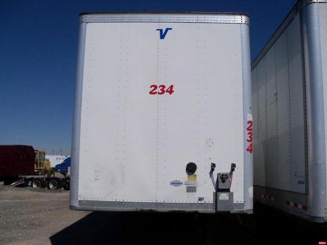 Rear view of a white 2019 Vanguard Dry Van VXP trailer with red number 234 and blue Vanguard logo, hitch area visible.