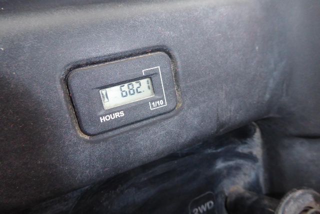 Hour meter reading 682.1 showing Kawasaki KAF950G truck equipment dashboard area.