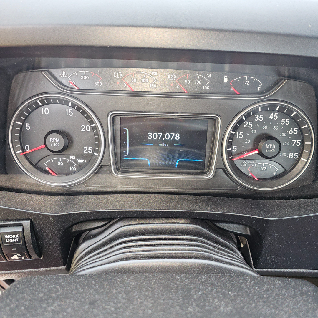 Dashboard of a 2020 International LT showing speedometer, tachometer, and digital odometer reading 307,078 miles.