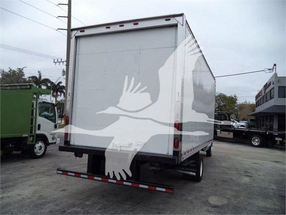 Ford E-450 box truck rear view with stock number T17033 and VIN 1FDXE4FS7BDB17033 visible in listing context.