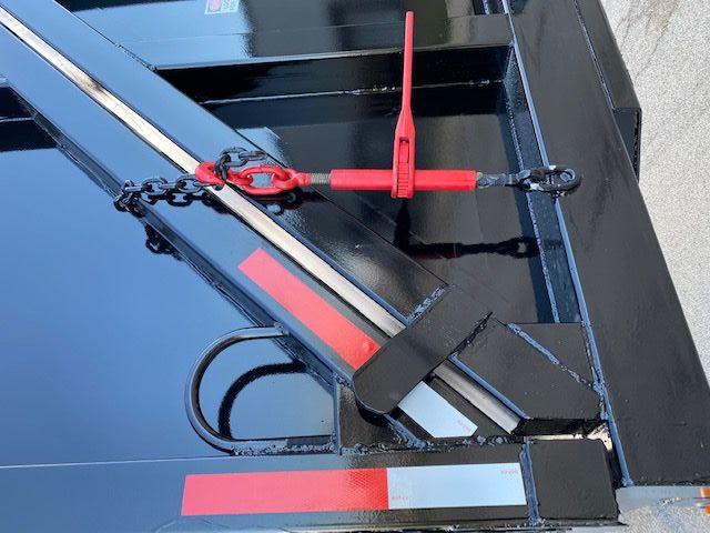 Crush car carrier trailer side showing hydraulic ramps and red safety lock, 2008 Transcraft 48 ft.