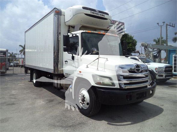 White Hydramax Thermo King reefer truck with a refrigeration unit on top, front grille chrome, side mirrors, and a large box trailer. The image shows a 