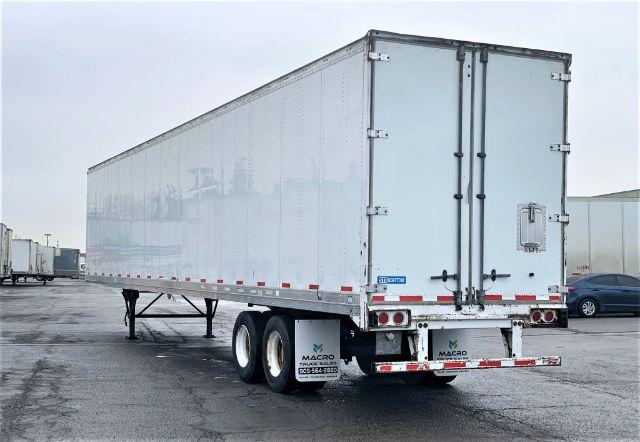 2013 Stoughton dry van trailer showing rear doors and tandem axles.