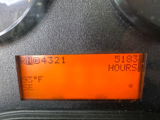 Digital display showing hours and codes: 'DM04321' on left, '5183' hours on right, '63F' near bottom left, 'SE' and asterisk on right.