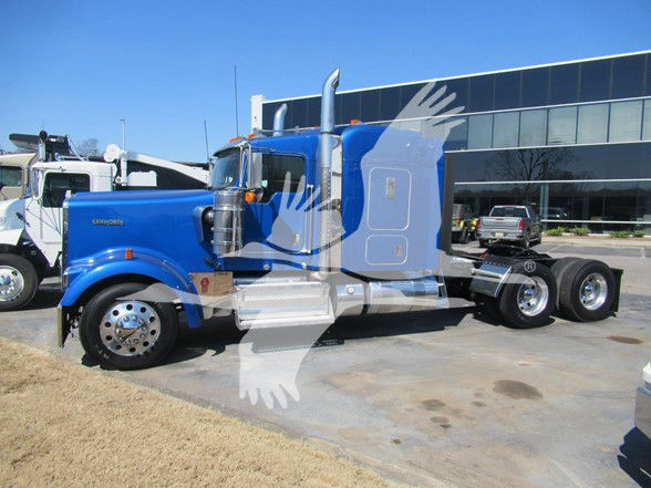 2018 Kenworth W900L conventional sleeper truck side view showing blue cab and dual rear axles.