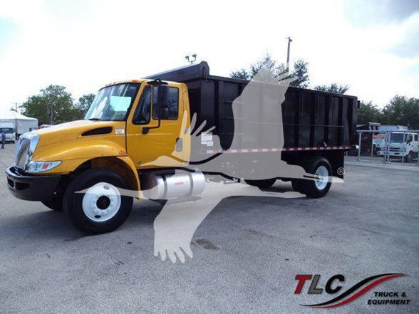 Yellow 2019 International DURASTAR 4300 dump truck in a lot with a black dump bed and large side mirrors.