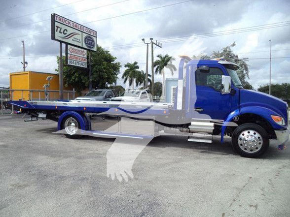 Blue Kenworth T280 tow truck with a flatbed, side view showing extended bed and dual rear axles.