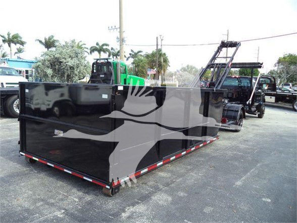 Chevrolet Silverado 6500HD refuse truck body in black with reflective red-white edge strips parked in lot.