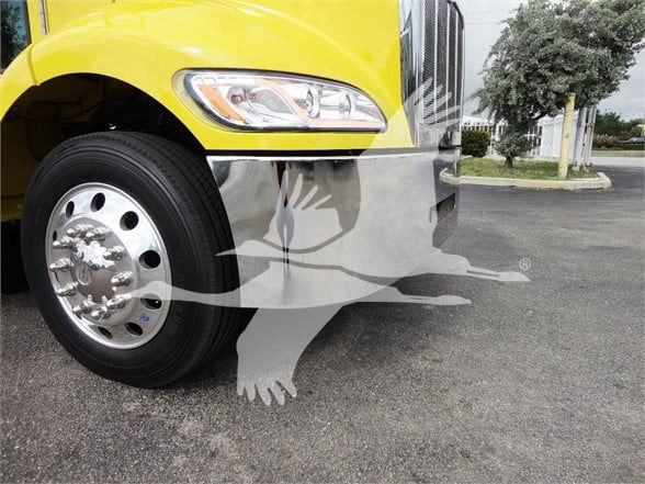 Peterbilt 337 front wheel well and bumper showing yellow cab and chrome grille with headlight, partial logo watermark over image.