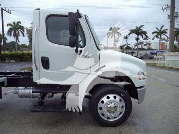 Wheel-view of a white Freightliner Business Class M2 106 cab with front fender and wheel, side step, fuel tank, and chassis visible.