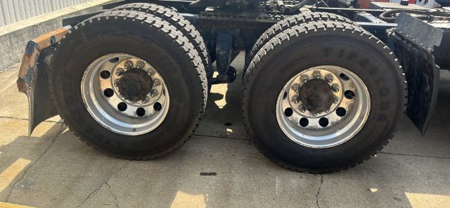 Dual rear truck wheels on Freightliner Cascadia chassis showing dual tires and rims.