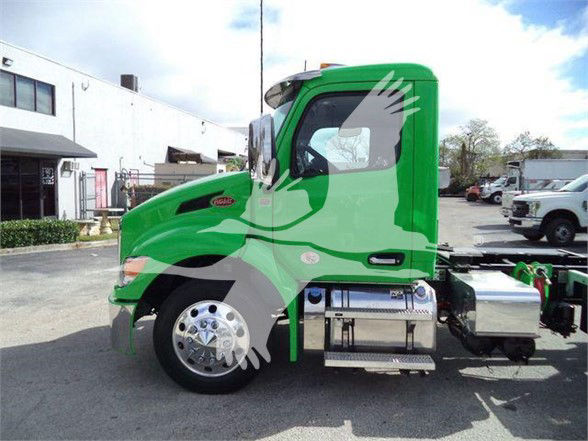 Green Peterbilt 536 truck side view with stock and category labels visible.
