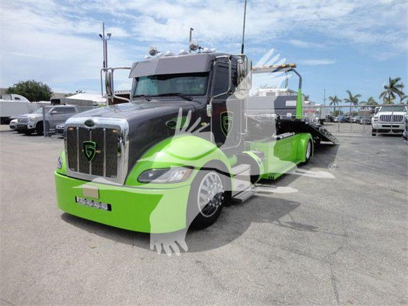 Peterbilt 337 tow trucks showing bright green and black two-tone cab and chassis with a long wheelbase.