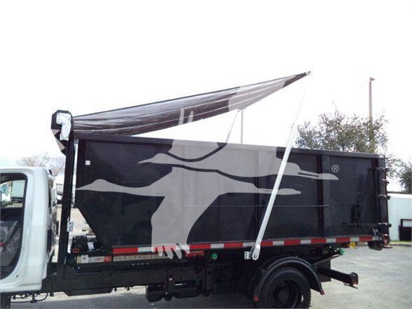 Truck bed of a 2023 Chevrolet Silverado 6500HD refuse truck with a black dump bed and graphic side panel.
