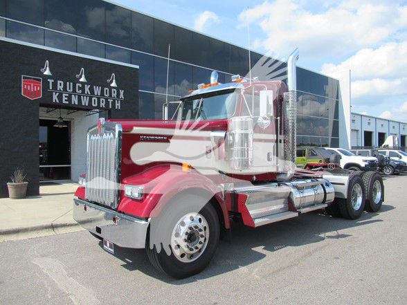 Kenworth W900L truck in red with chrome accents at Truck Worx Kenworth dealership.