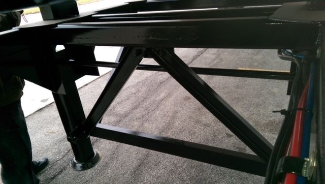 Great Dane 40 ft round bottom trailer frame showing support legs and metal beams.