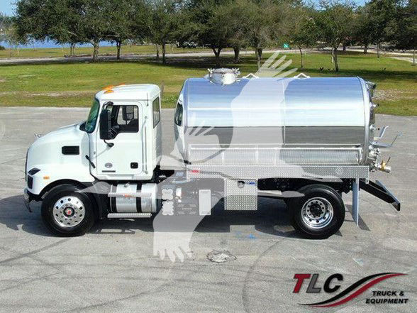 Tank truck showing polished stainless steel cylindrical tank mounted on a white Mack MD7 chassis with chrome accents and TLC Truck & Equipment logo.