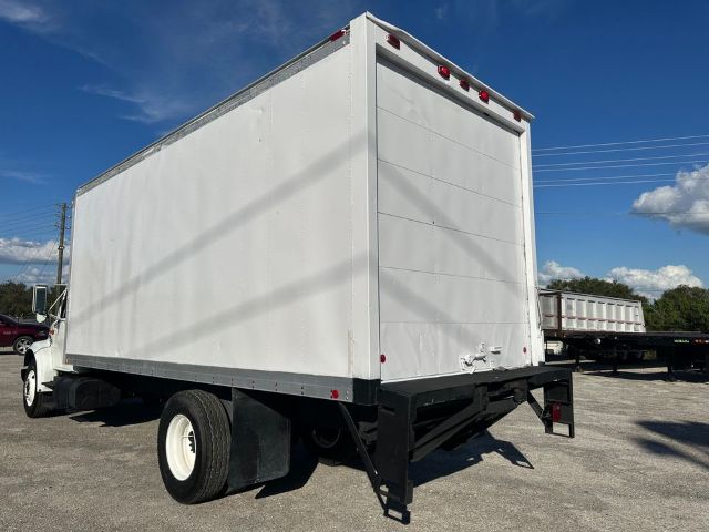 1997 International 4700 box truck, white cargo body, rear view with liftgate and wheels.